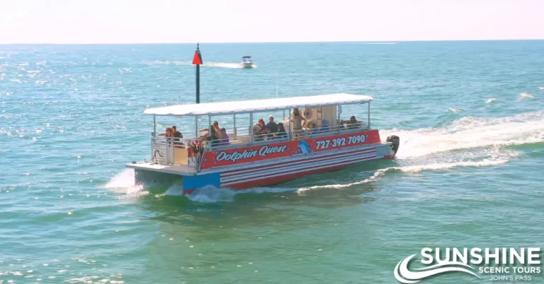 Dolphin Quest" tour boat on sparkling water. | SST