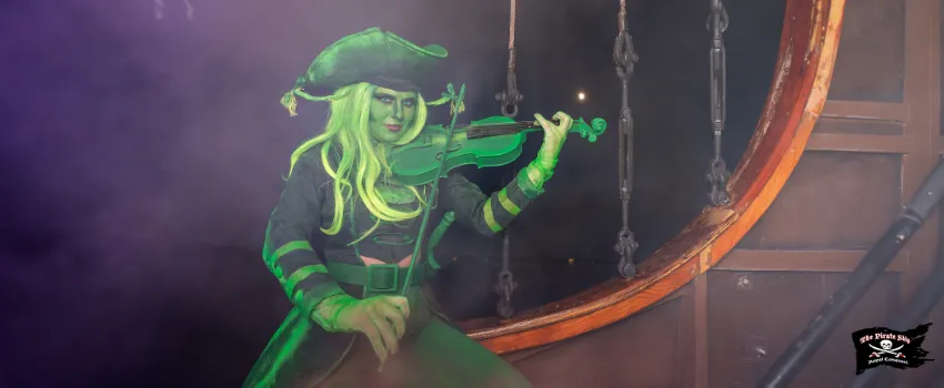 SST - A green pirate woman playing a violin