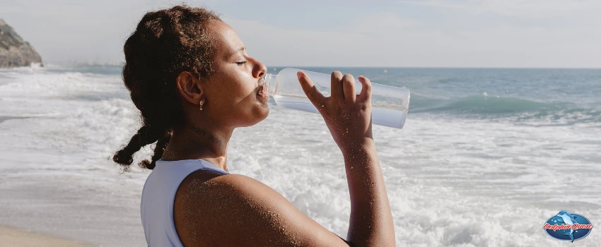 SST - Woman Staying Hydrated By The Beach