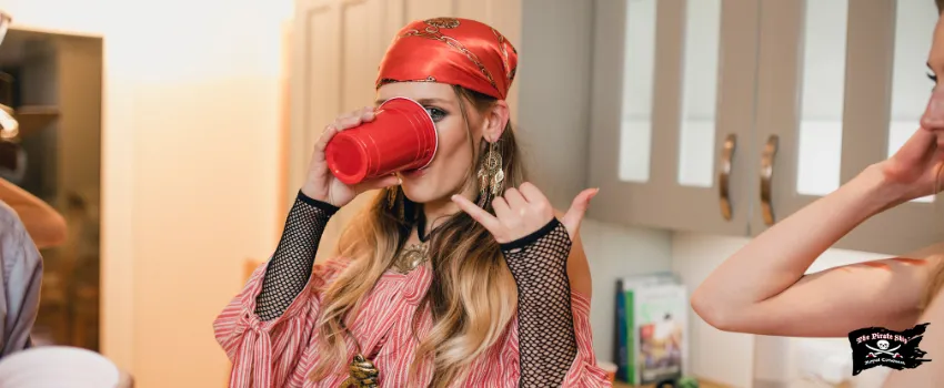 SST - Woman dressed as a pirate drinking at a party